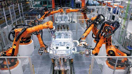 Industrial robots on the factory floor Industrial robots on the factory floor